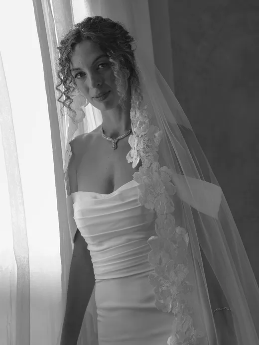 curly hair bride wears hair down for classic and chic malibu wedding day