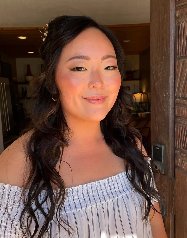 Joshua tree bride smiles after getting hair and makeup done. She feels like herself and loves that she doesn't look too overdone.