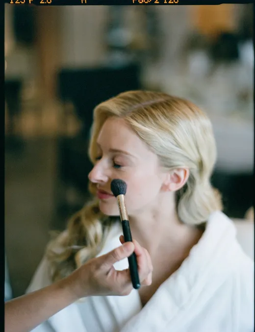 makeup application on bride's wedding day