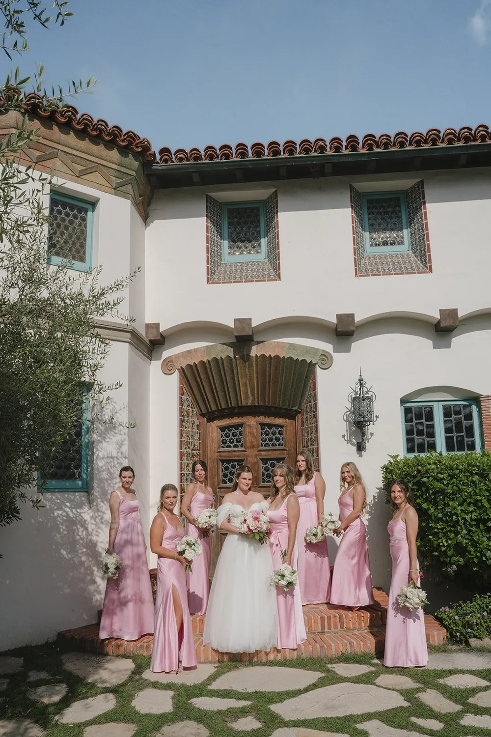 Bridesmaids in blush colored bridesmaid gowns for Palos Verdes wedding