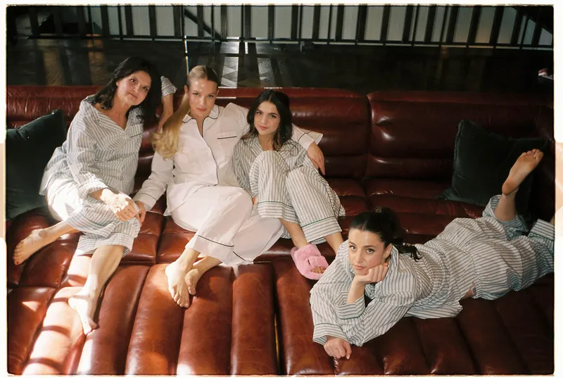 bride and bridesmaids pose for getting ready photos before iconic wedding ceremony laguna beach
