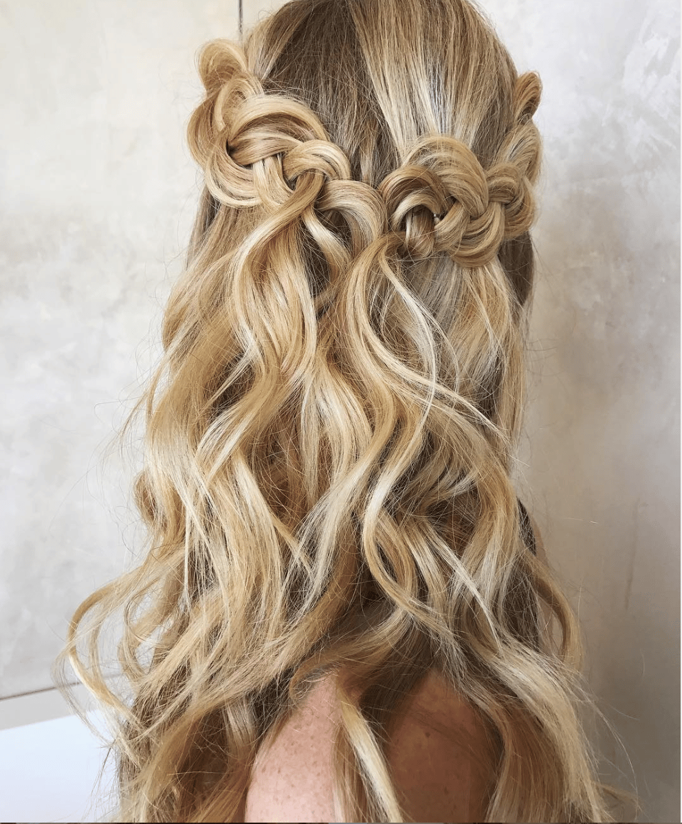 half up, half down braided hairstyle with romantic and loose waves