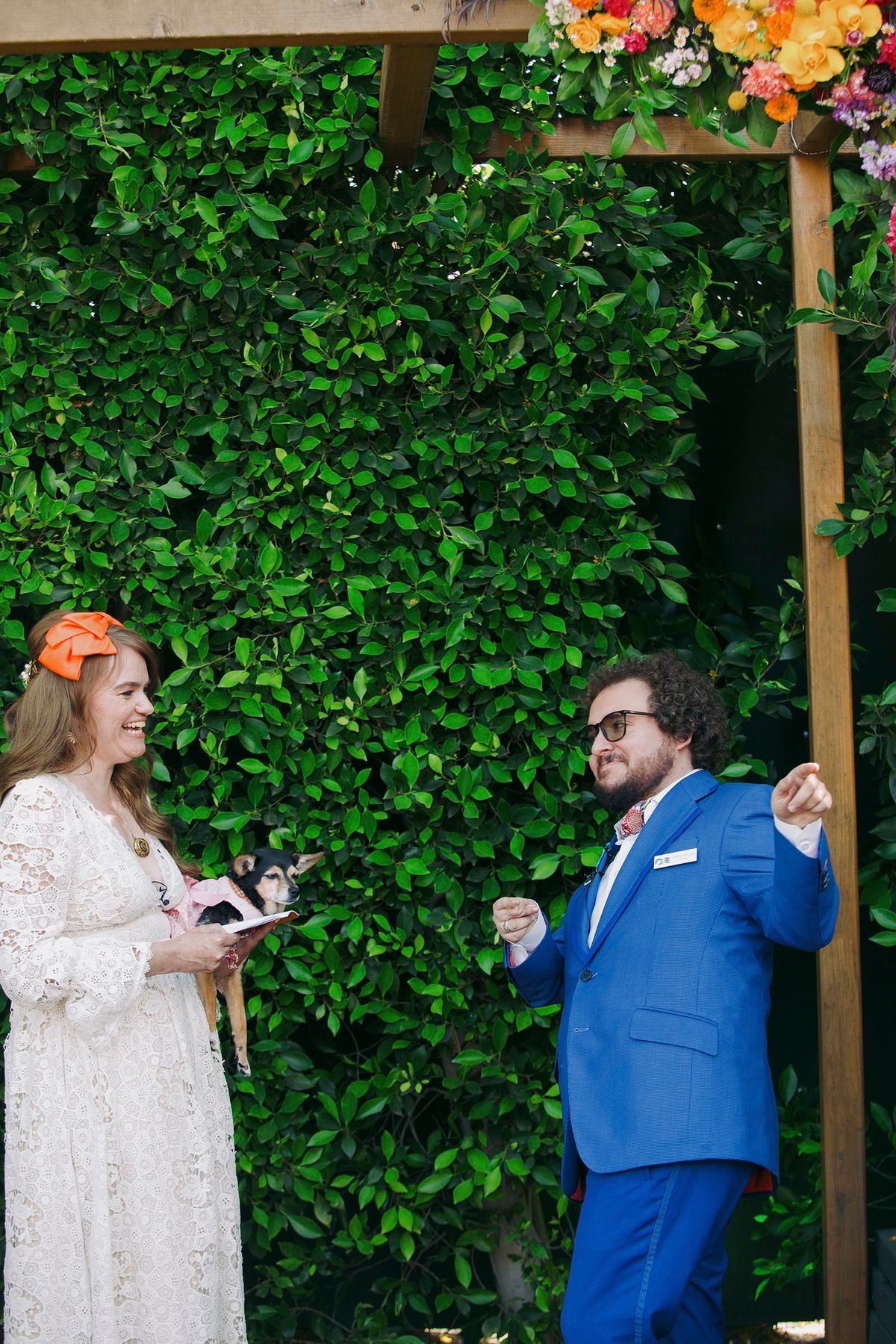 adorable couple's dog is in their wedding ceremony