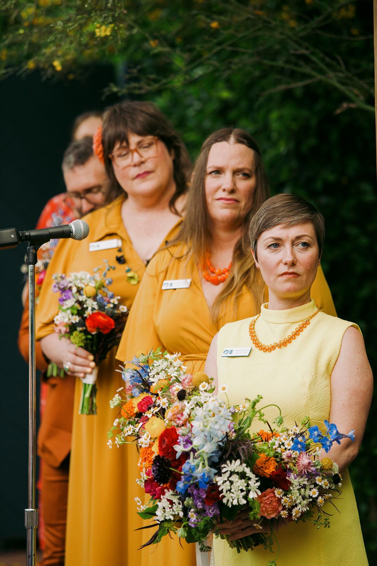 the bridal party wore 60's and 70's themed bridesmaids dresses and vintage outfits
