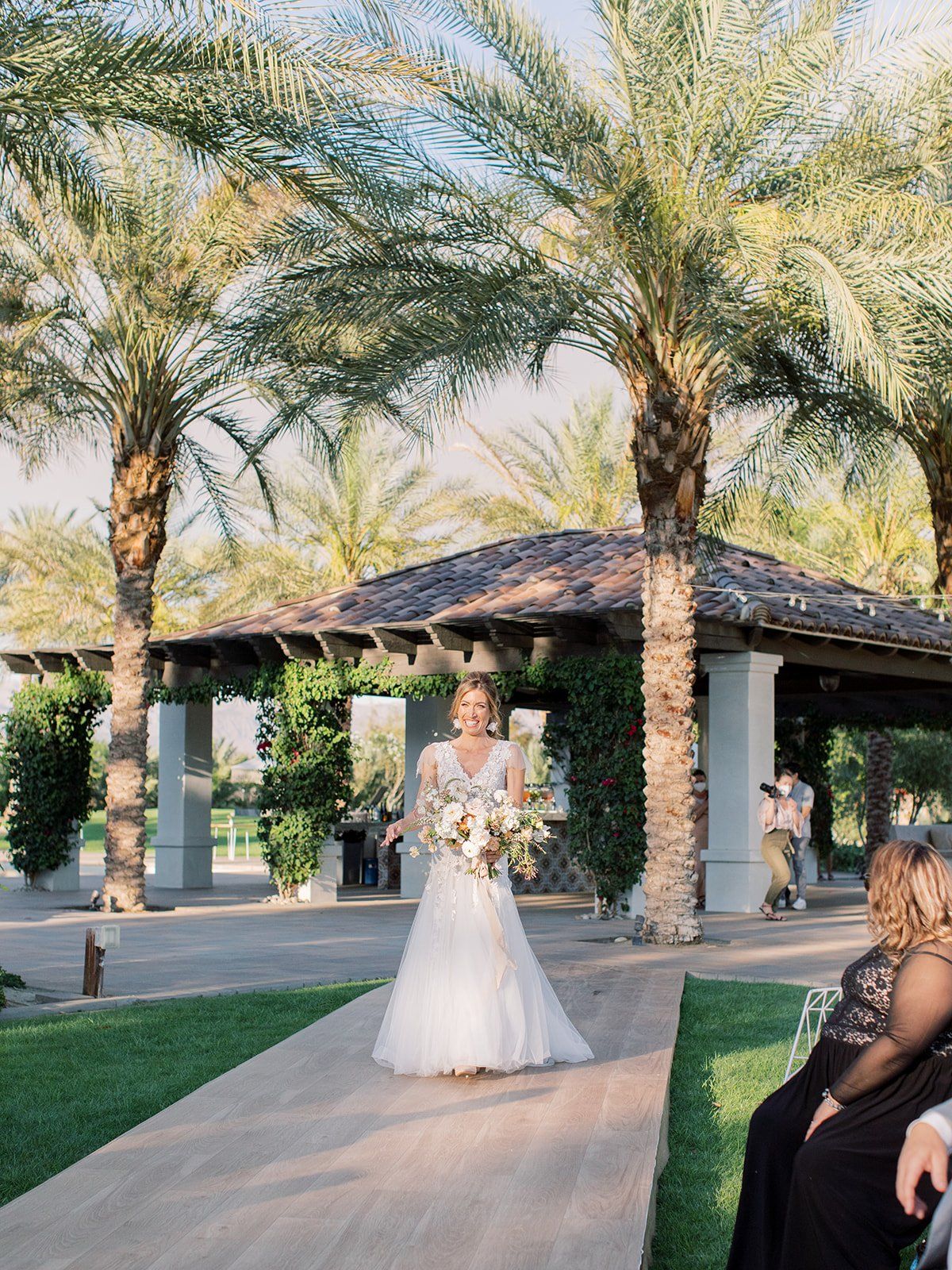 bride walking down the isle for her wedding in Coachella Valley California