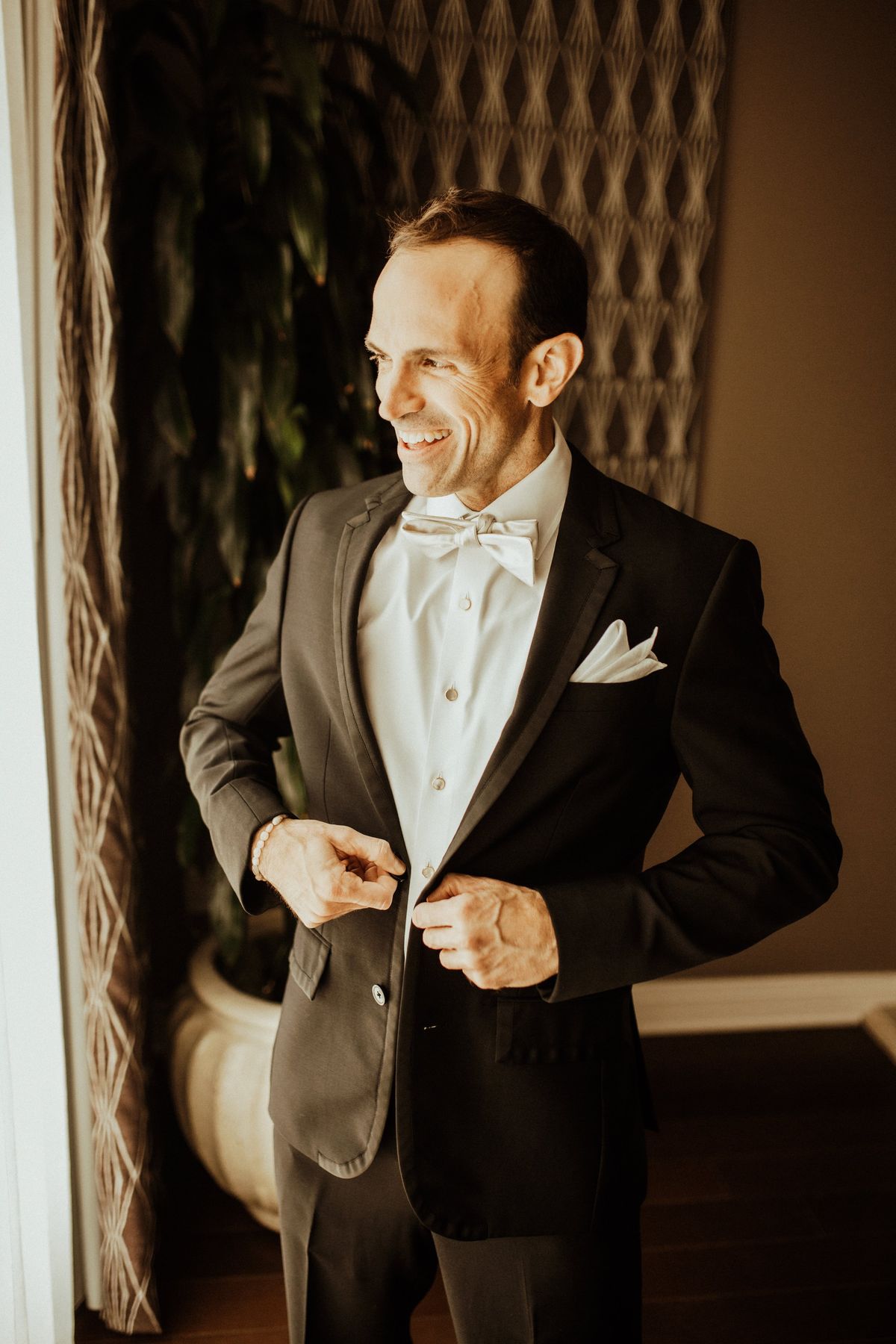 groom gets into this suit before the wedding