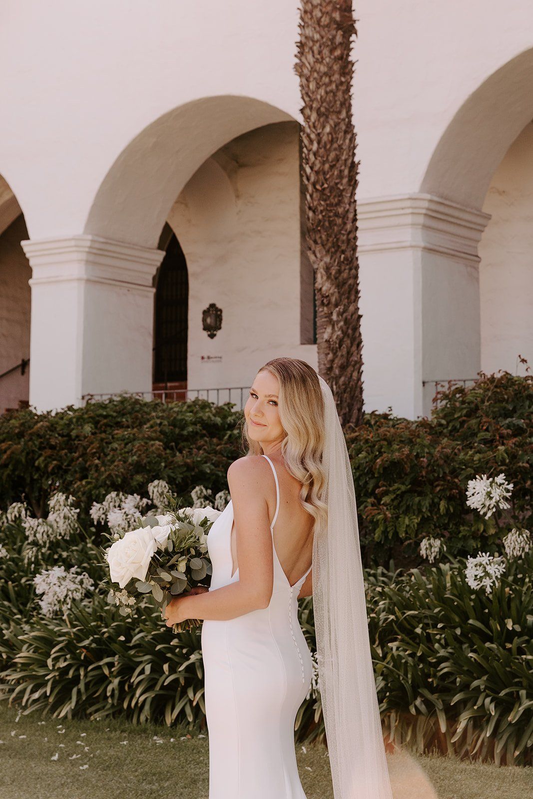 bride chose airbrush makeup for a natural look on her wedding day, with brushed out effortless wave hairstyle