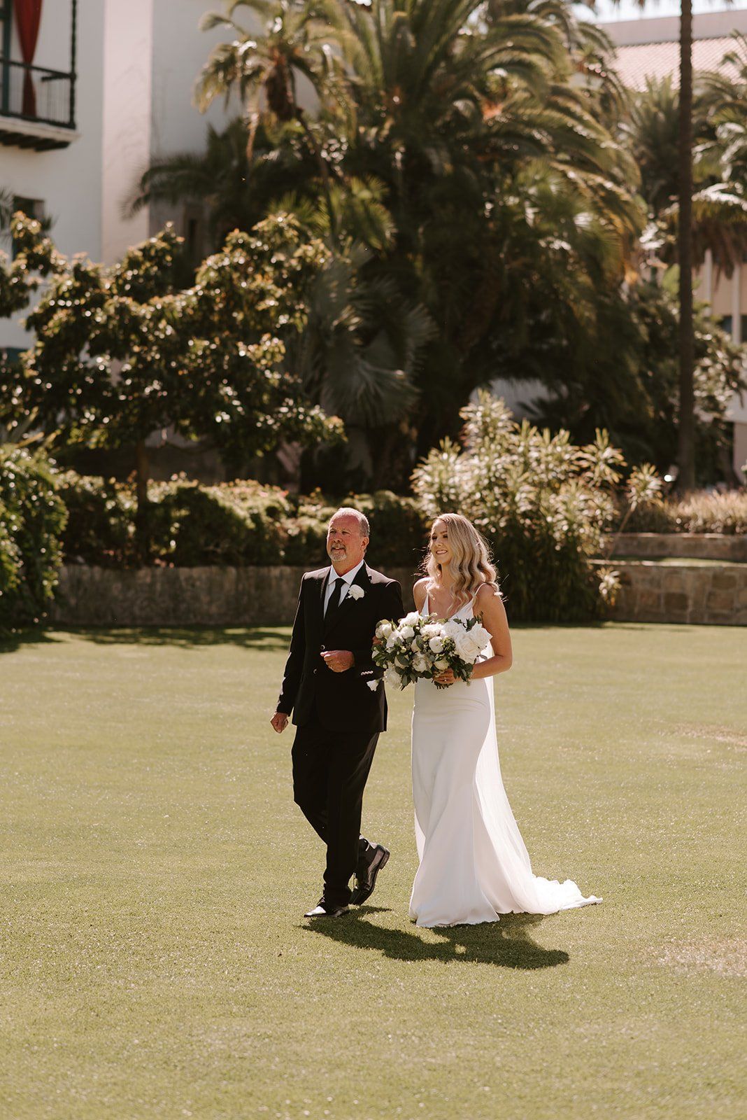 bride walks down the aisle on her wedding day in santa barbara