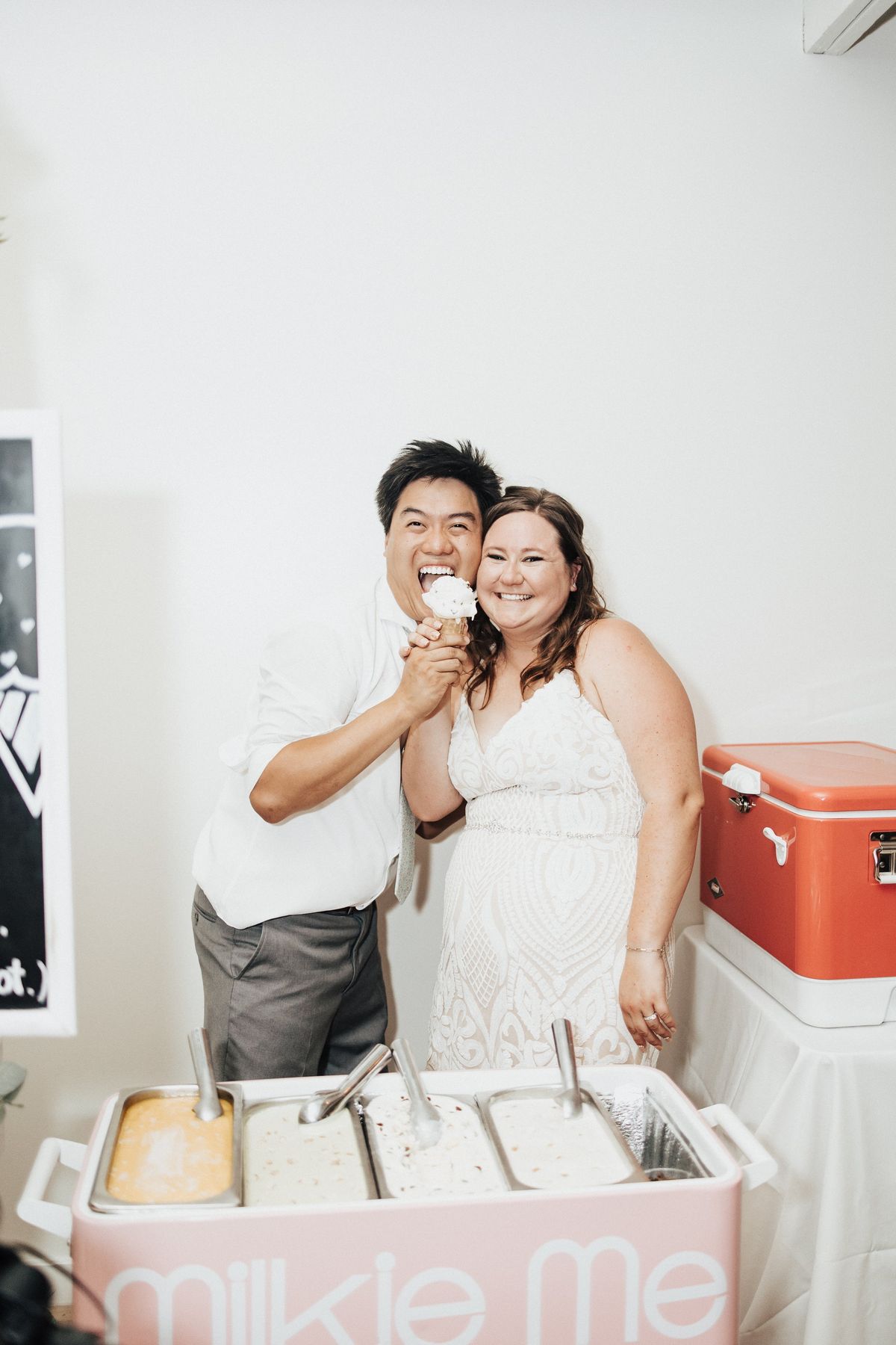 bride and groom scoop ice cream