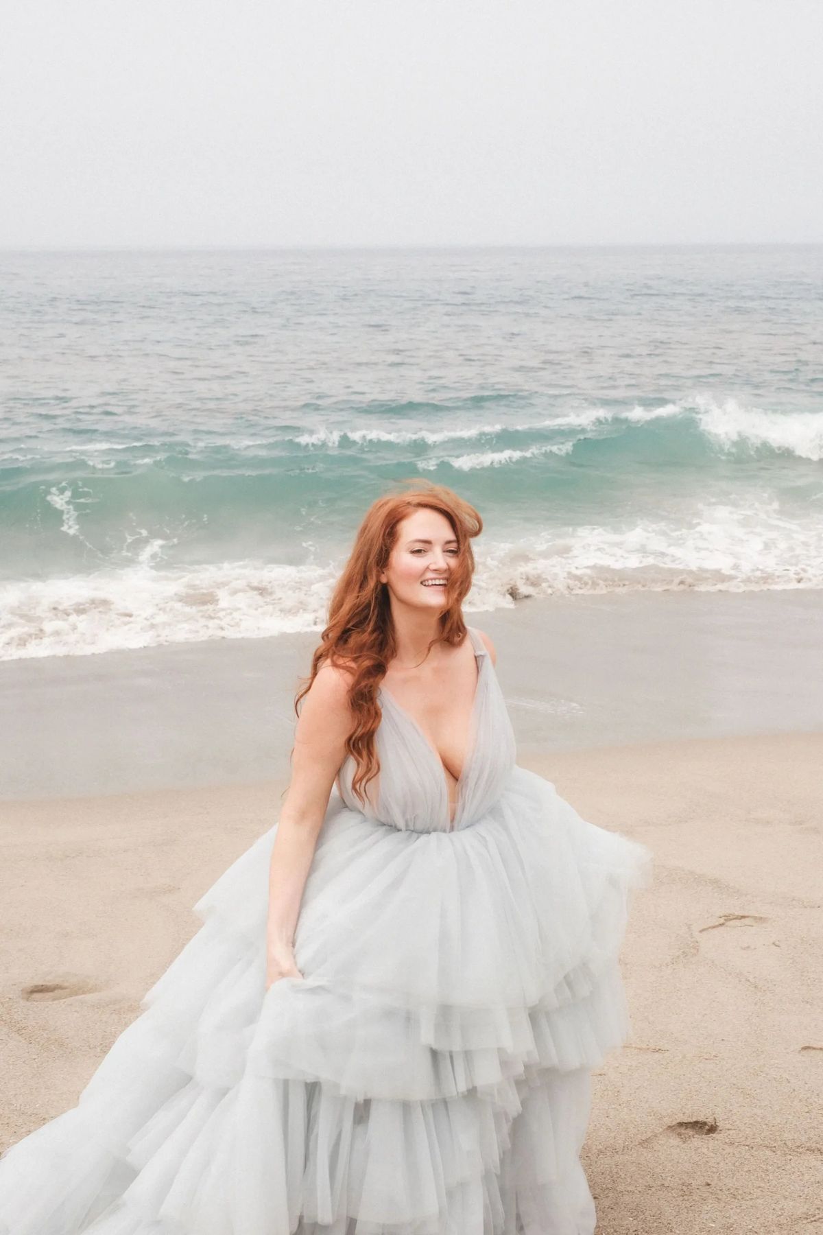 bride in blue wedding dress with beachy bridal hairstyle