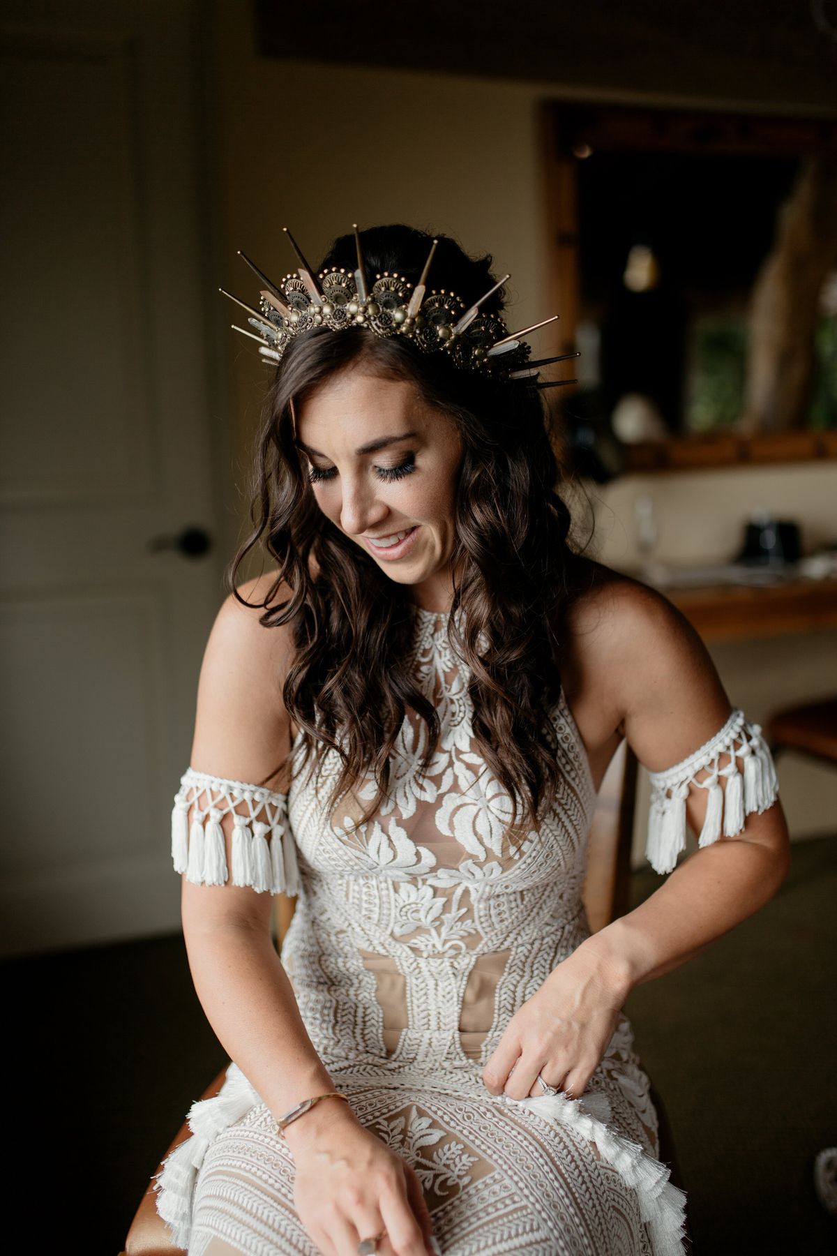 bride getting ready in her grace loves lace gown