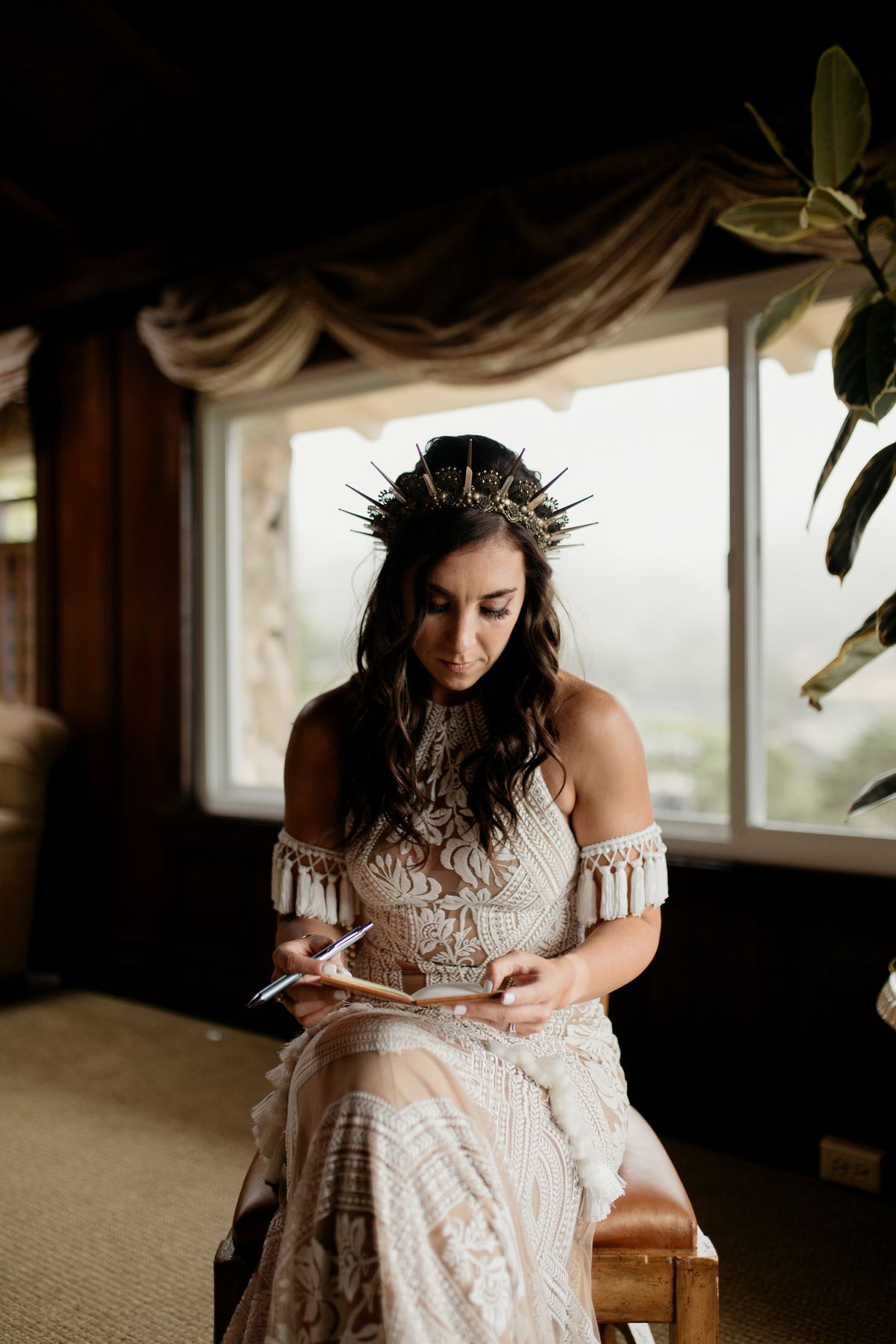 bride writing vows before her destination elopement ceremony in Big Sur