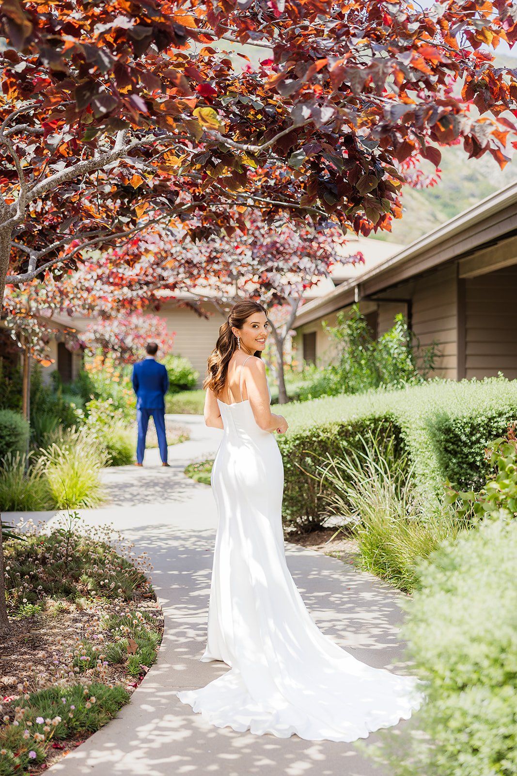 bride and groom get ready for their first look in laguna beach