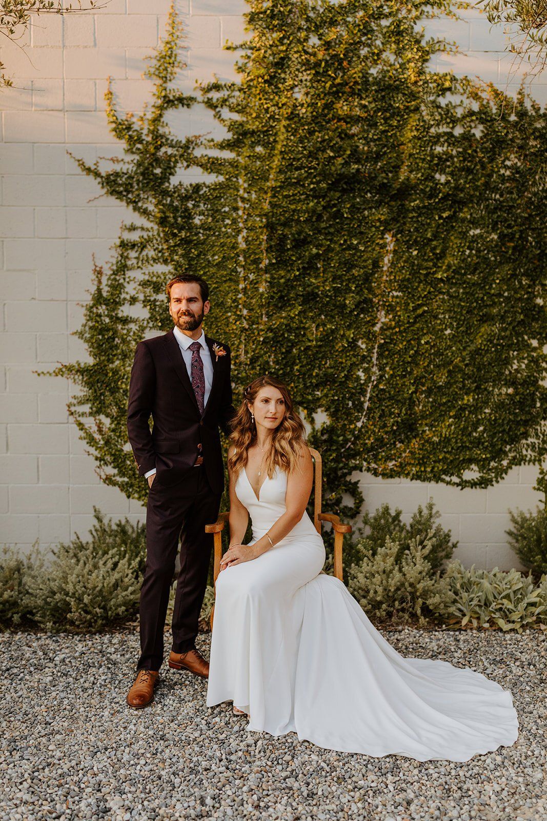 newlyweds pose for bridal portraits after their orange county wedding ceremony