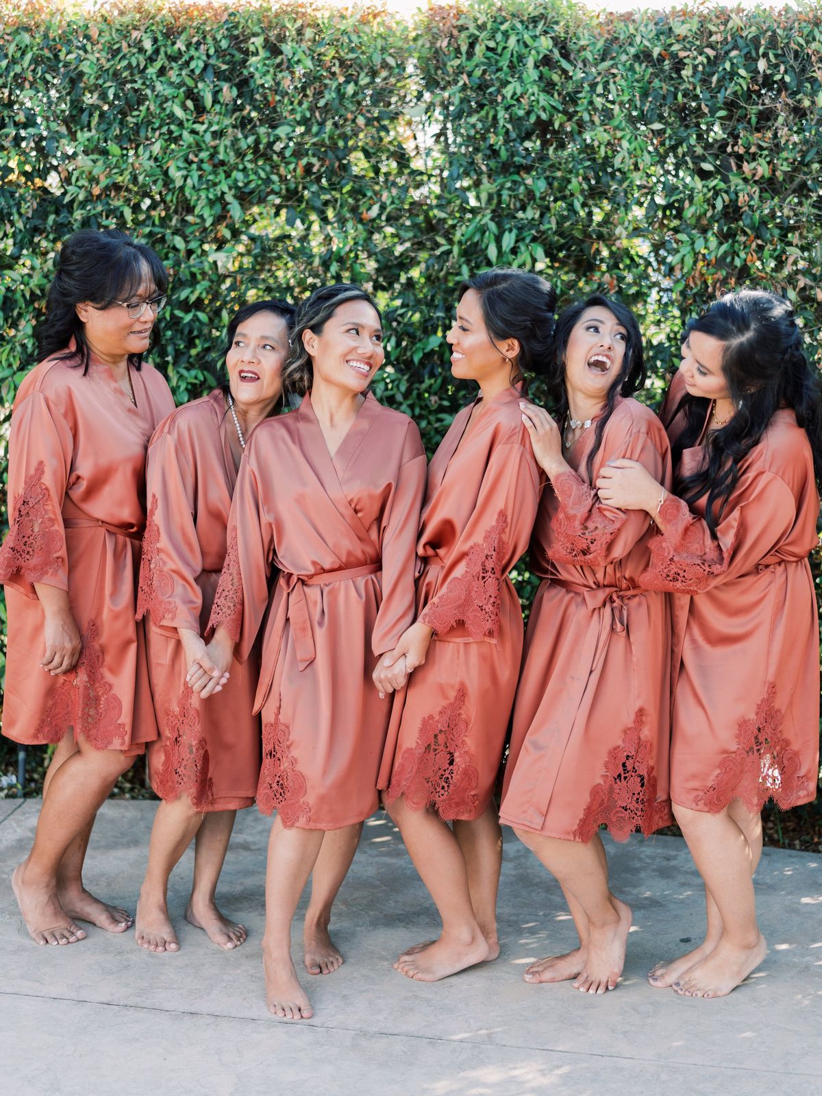 bride and bridal party hair and makeup ready for the wedding
