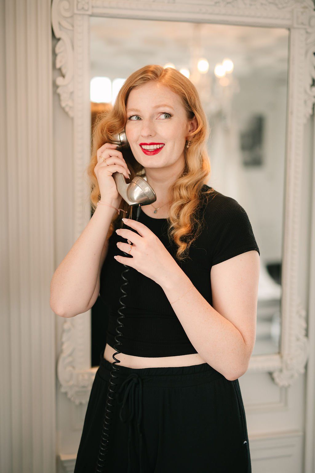 los angeles hair stylist created an old hollywood glam hairstyle with bold and big brushed together curls