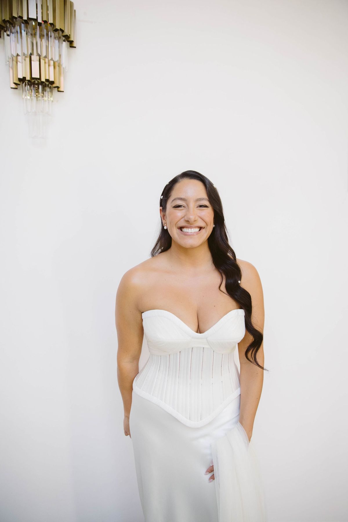 bride is glowing after hair and makeup is complete at her destination wedding in mexico