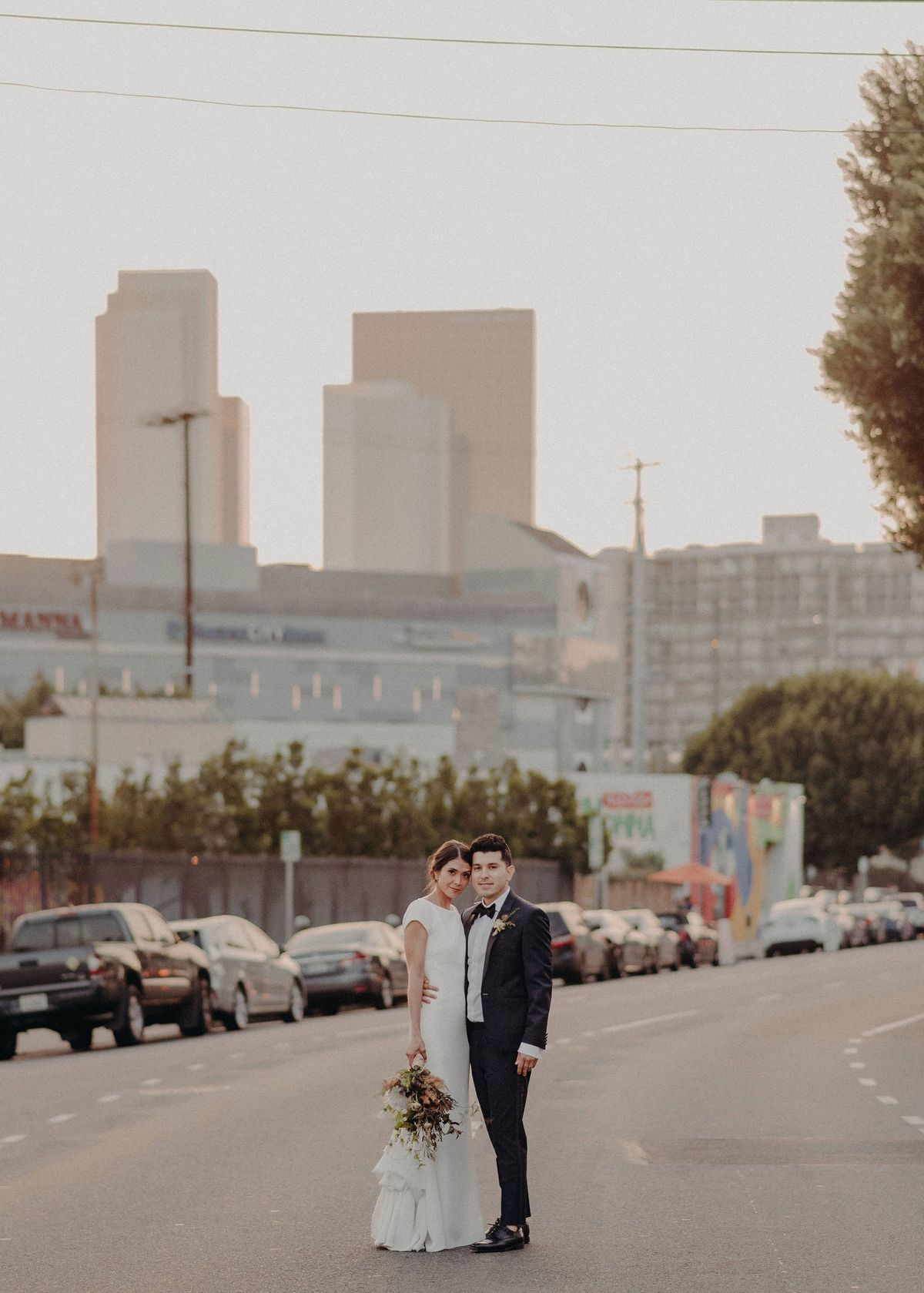 bride and groom walk around DTLA after their wedding ceremony