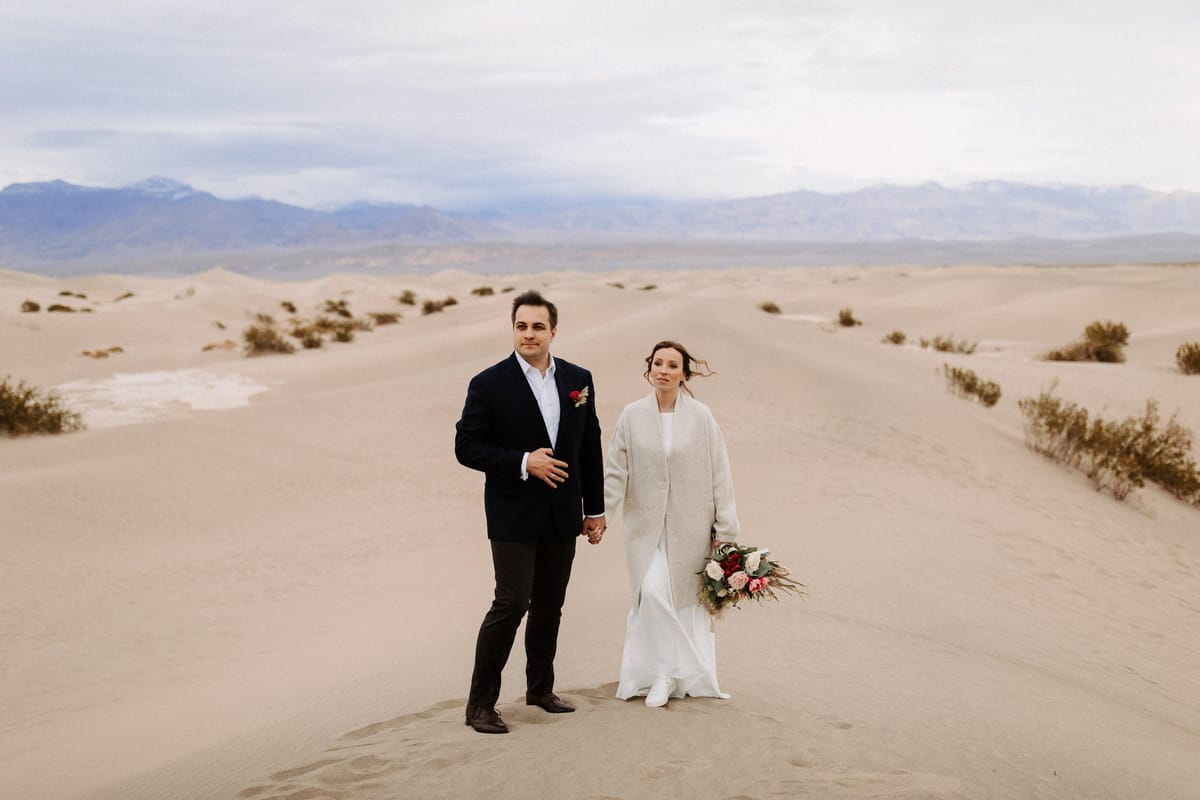bride and groom share intimate elopement at sand dunes in death valley national park