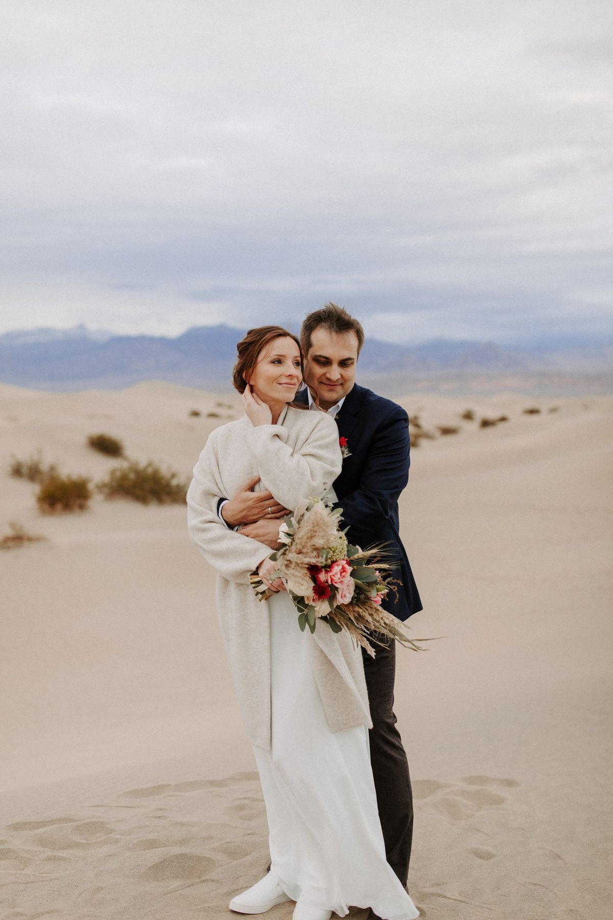 couple photos on the sand dunes after death valley national park wedding