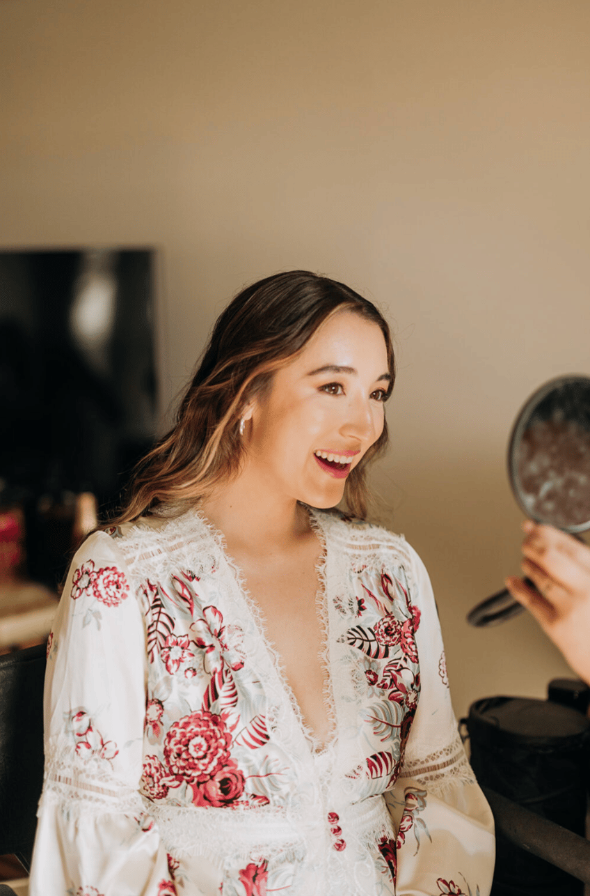 Glowing makeup look and loose curled bridal hairstyle for malibu bride at adamson house