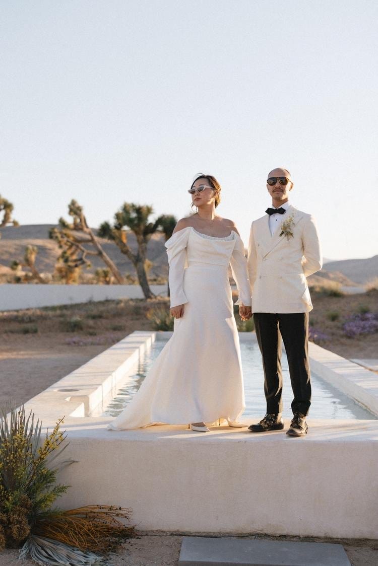 fashion forward couple travel to joshua tree desert for destination wedding weekend