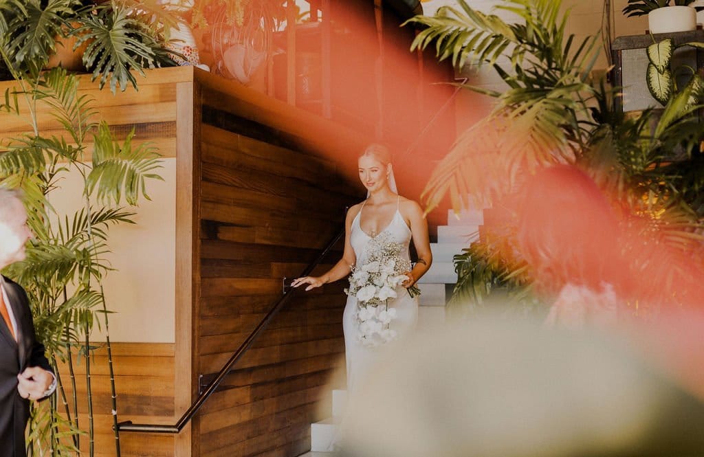 bride walks down the isle at smogshoppe
