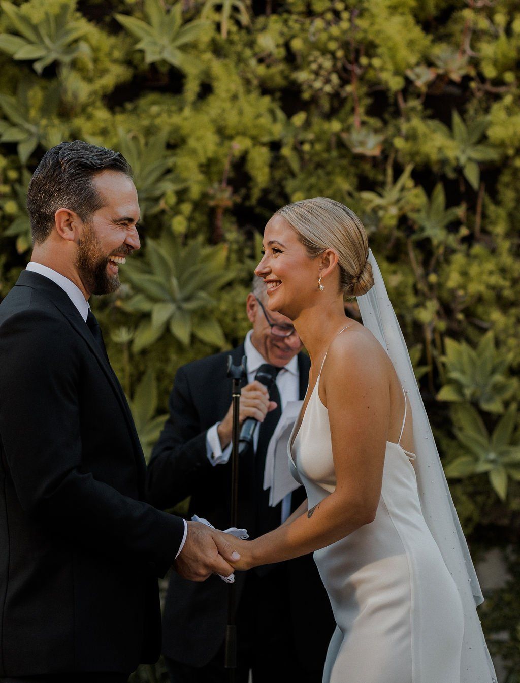 happiness and pure joy as bride and groom recite their vows