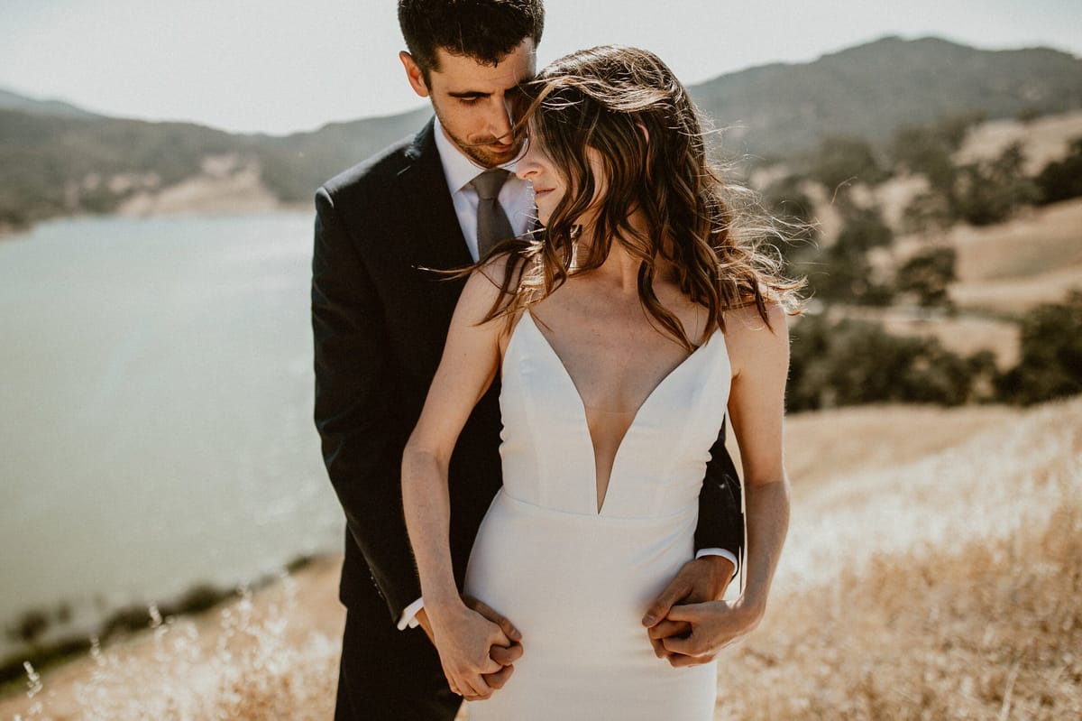 bride and groom romantic portraits cliffside at alisal ranch
