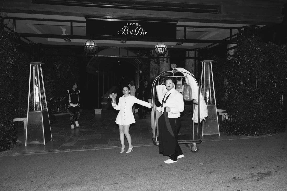 iconic bride and groom caught exiting the Hotel Bel Air after their wedding in los angeles