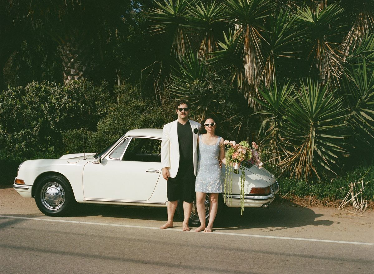 couple and their porsche 911 during iconic beverly hills elopement photoshoot