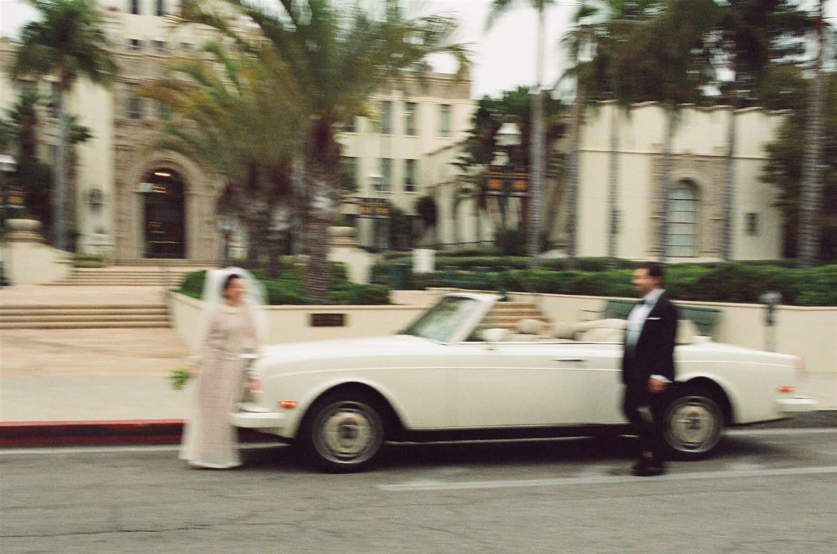 couple gets married at beverly hills court house in vintage rolls royce