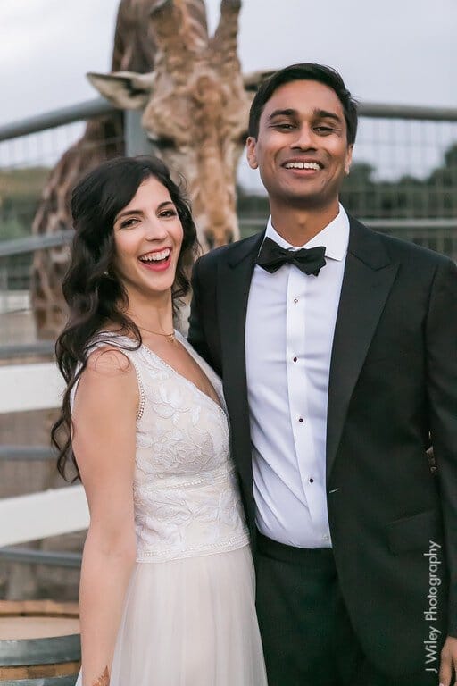 malibu bride and groom with stanley the giraffe at saddlerock ranch