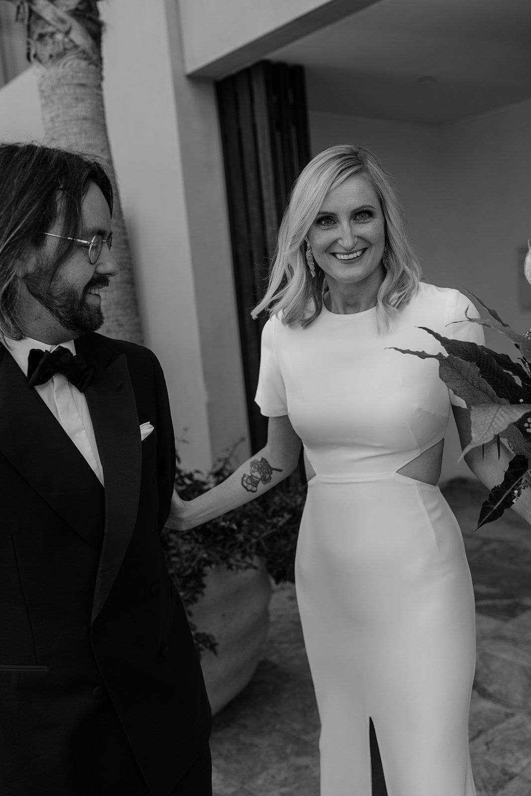 bride and groom smile in excitement for their modern destination elopement in beverly hills