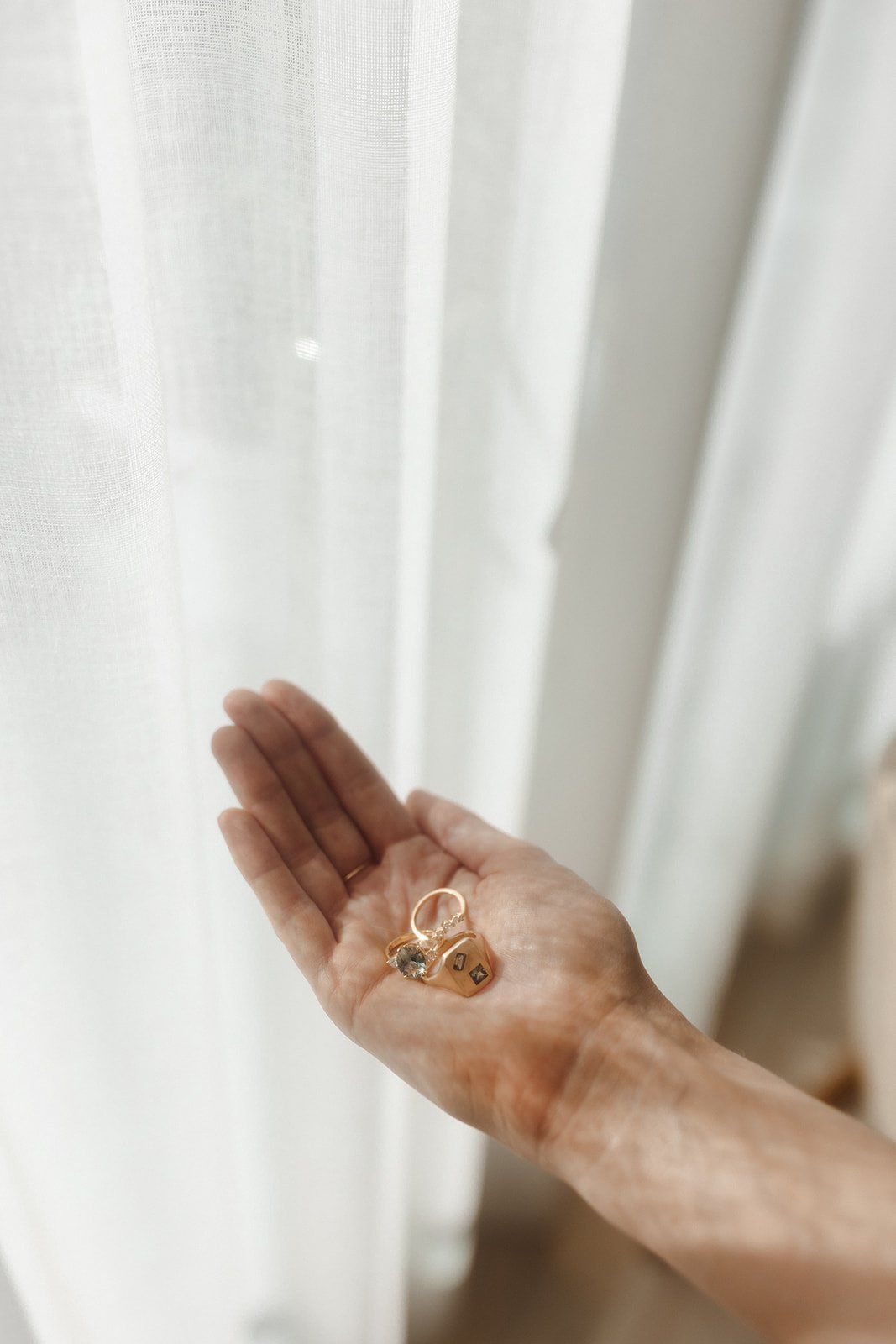 bride holds her set of rings