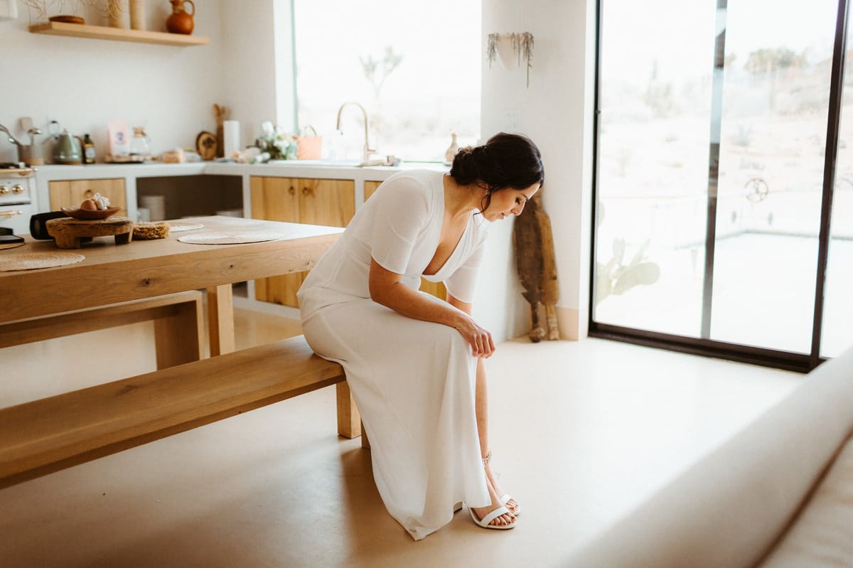 bride putting on her shoes