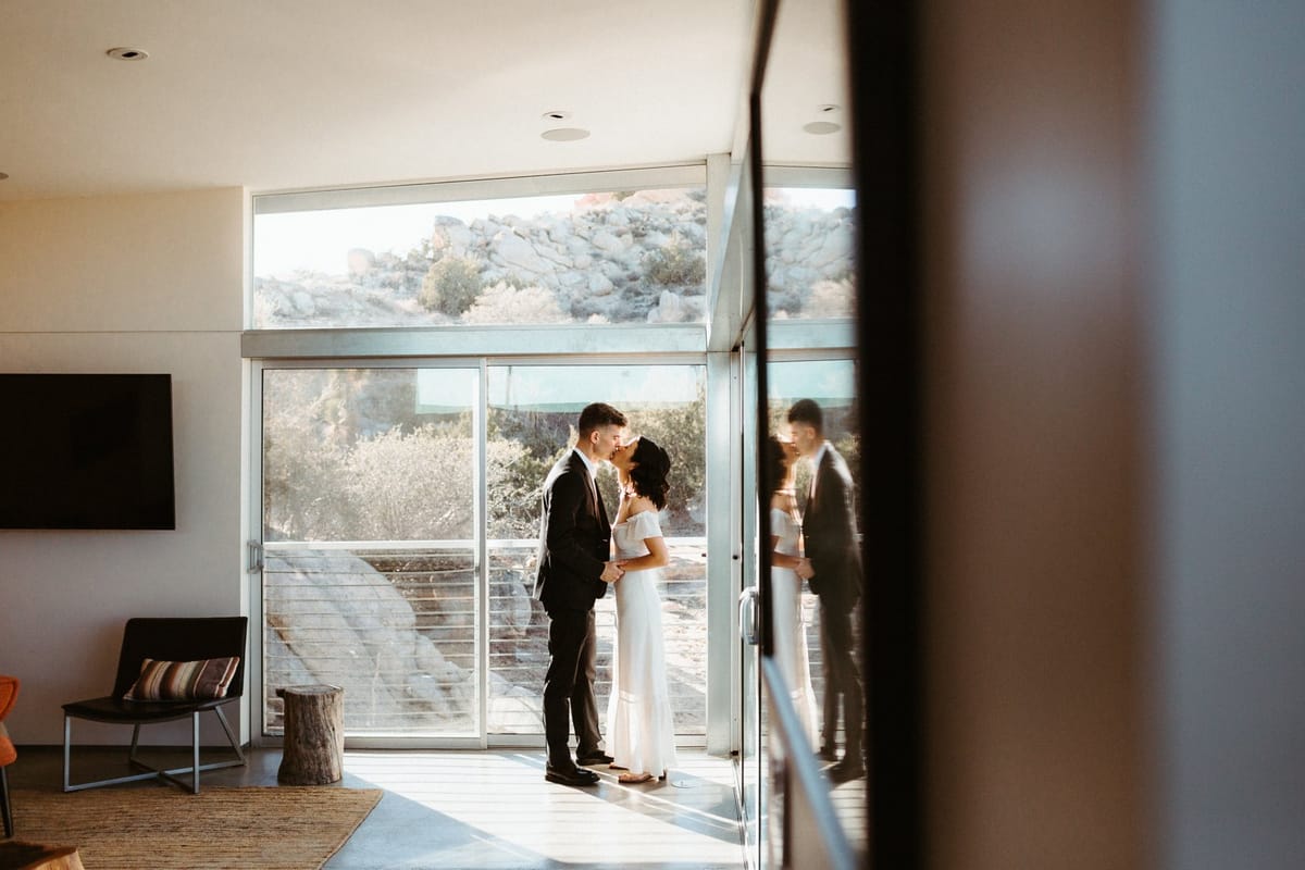 bride and groom choose rock reach house in joshua tree for epic wedding venue location