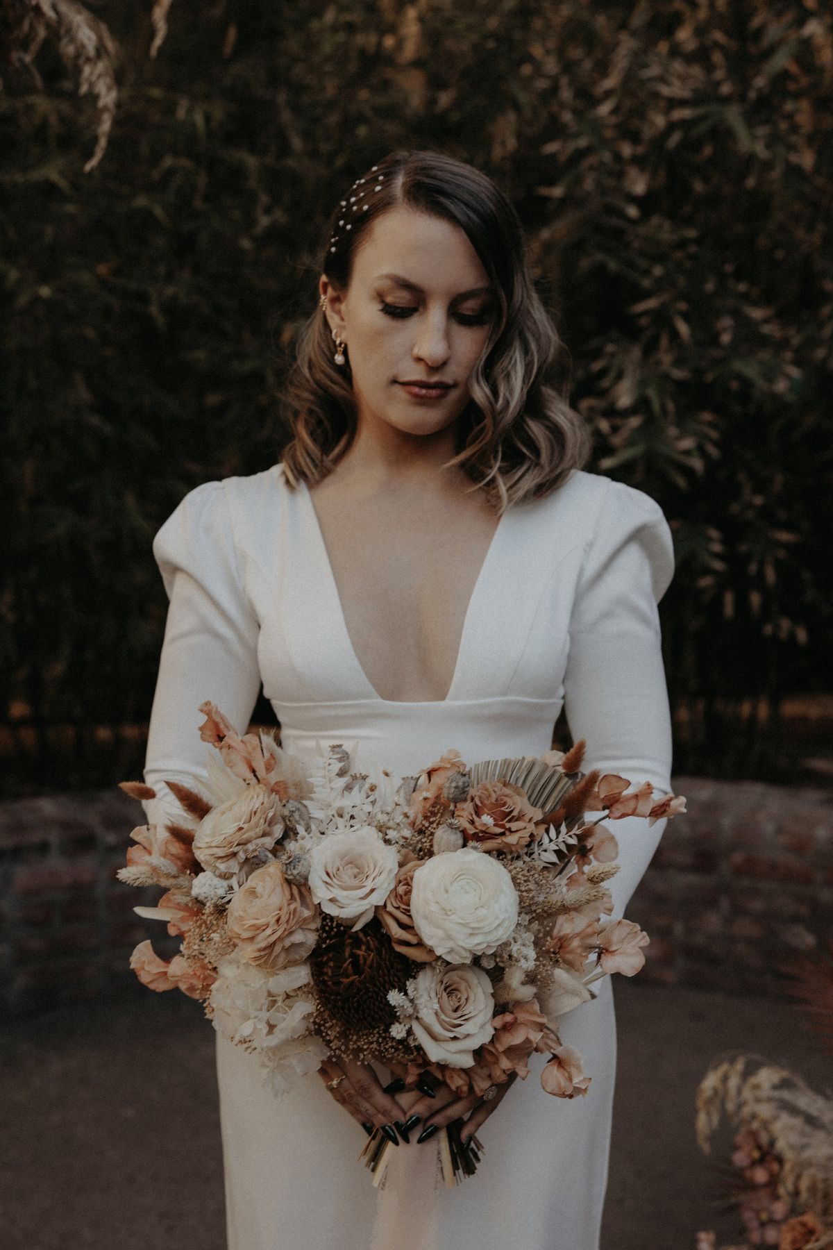 bride chose natural makeup accented with a winged liner and old hollywood waves