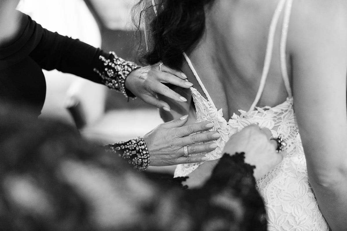 bride gets into her gown