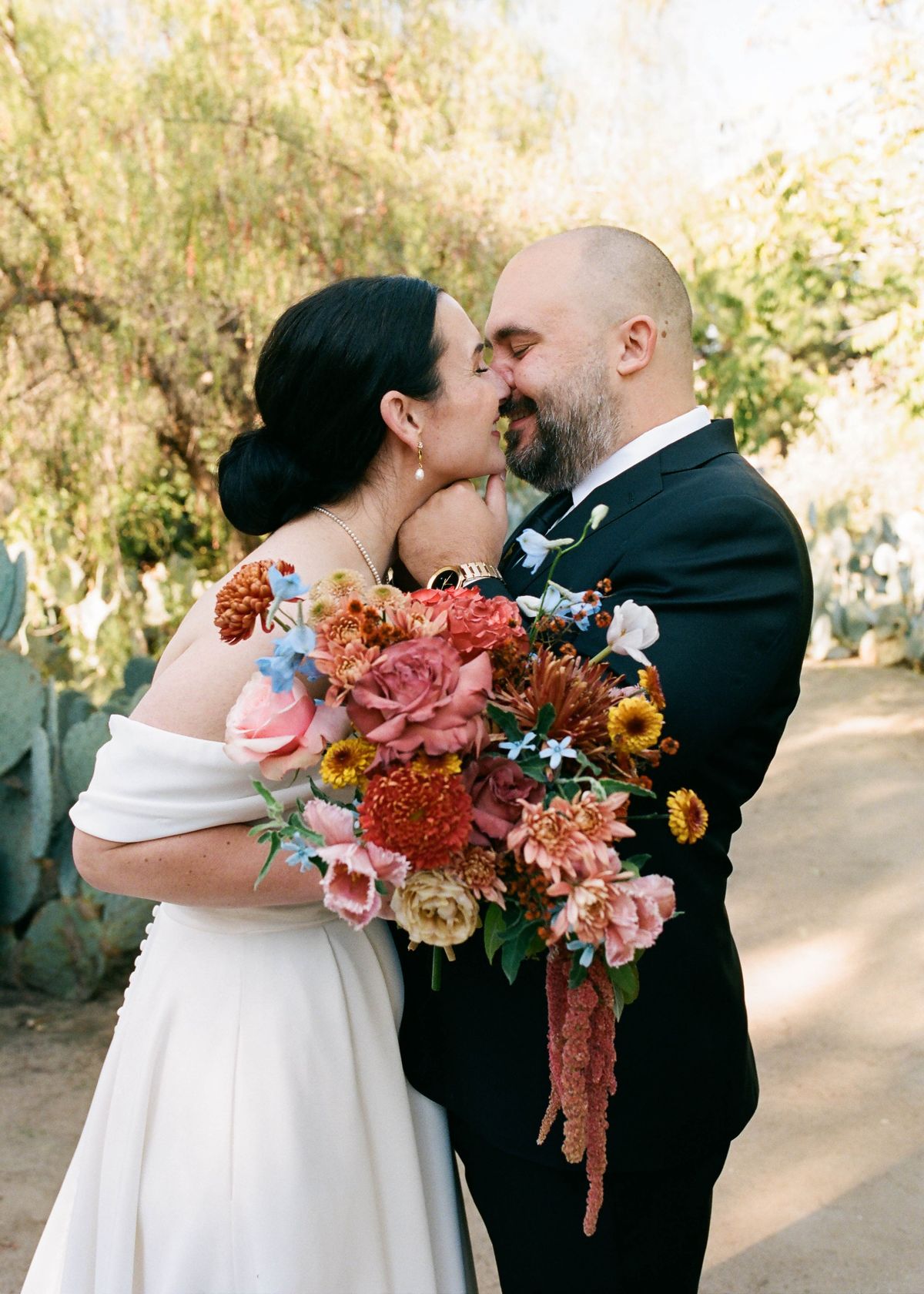 bride and groom share a kiss after being pronounced husband and wife