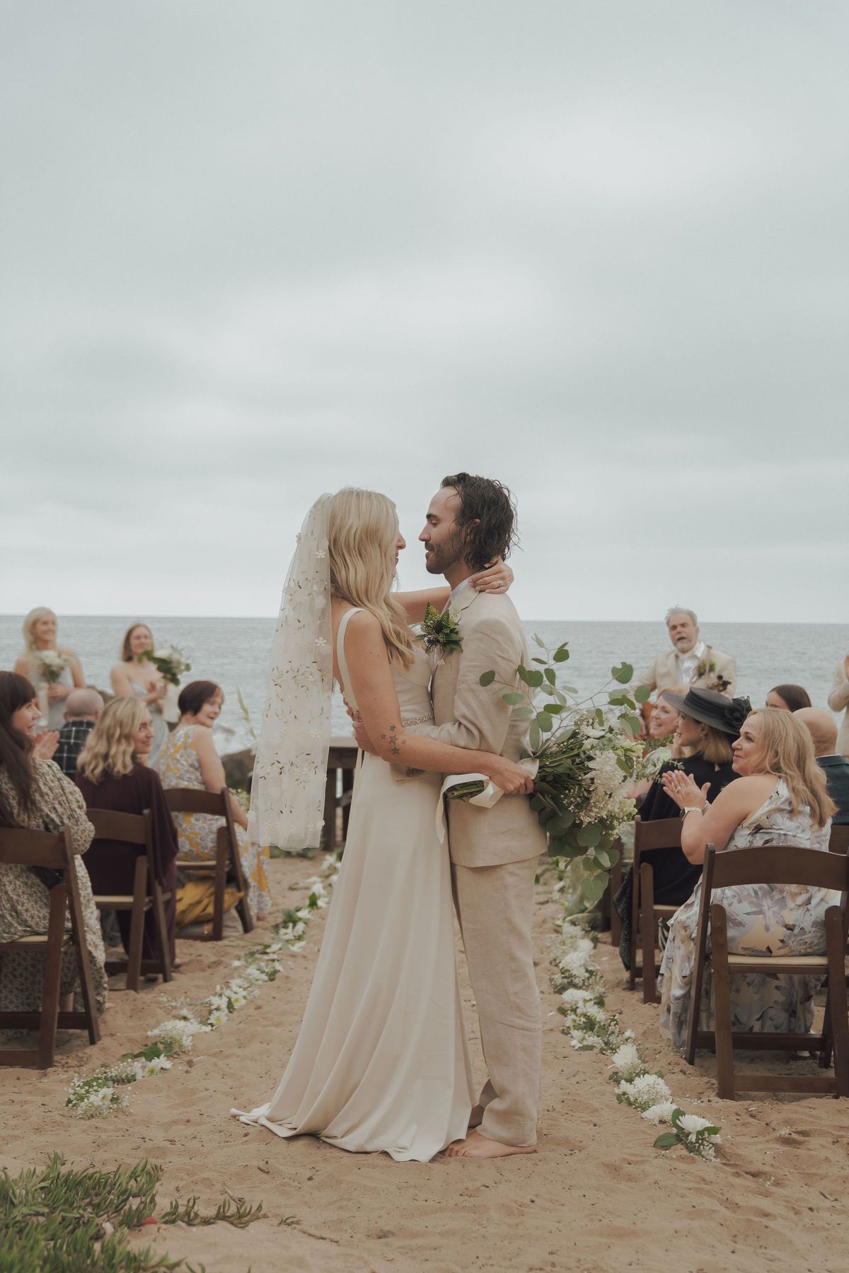 wedding ceremony along the cliffs of point dume beach in malibu