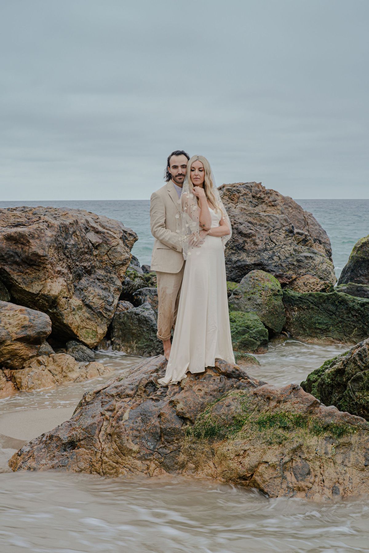 founder, podcast host, and manifestation coach plans wedding along the cliffs of point dume beach in malibu
