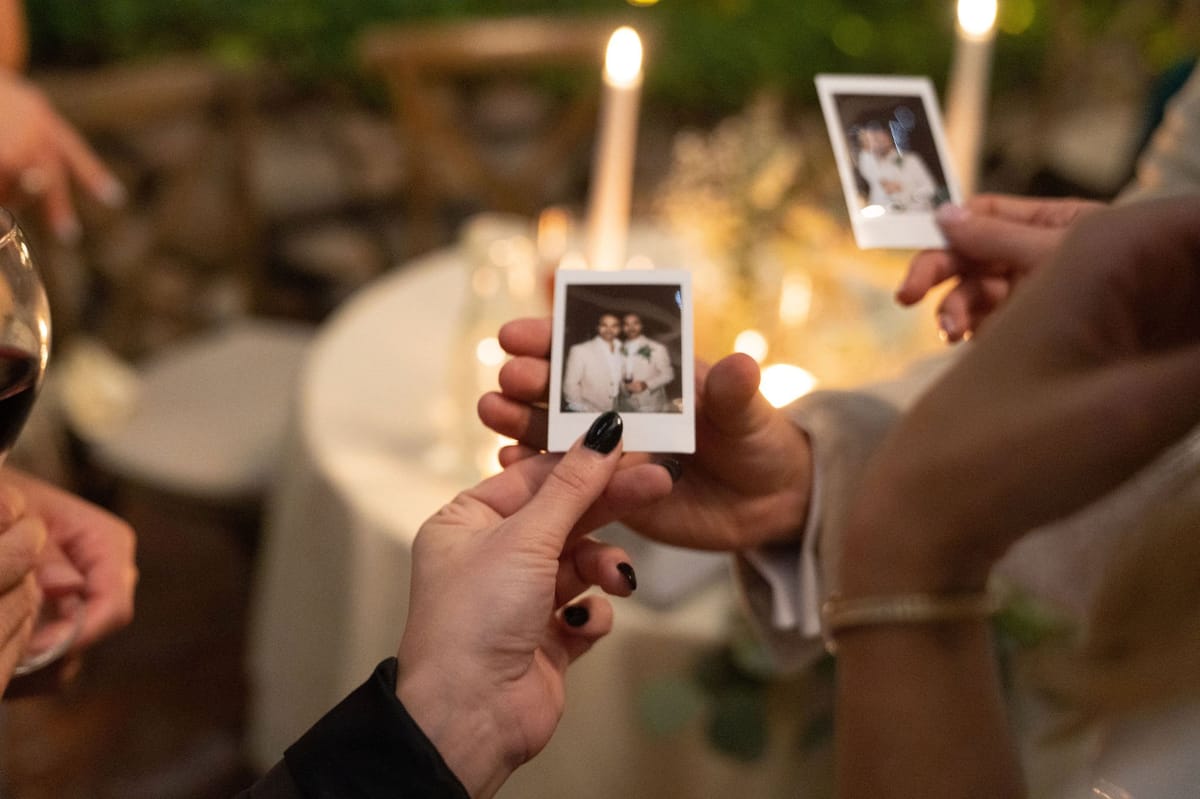 intimate wedding reception under the twinkle lights with guests at the inn of the seventh ray in topanga canyon, CA
