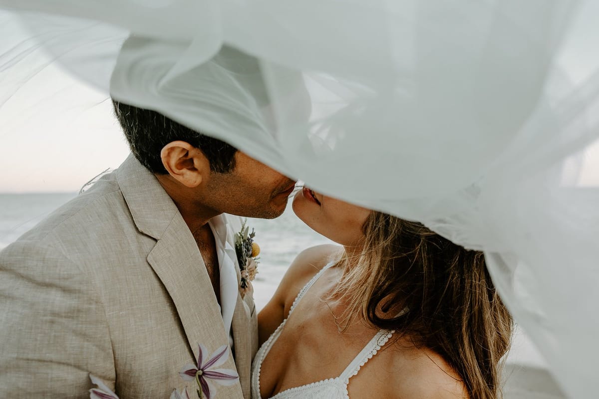 malibu bride and groom portraits on the beach