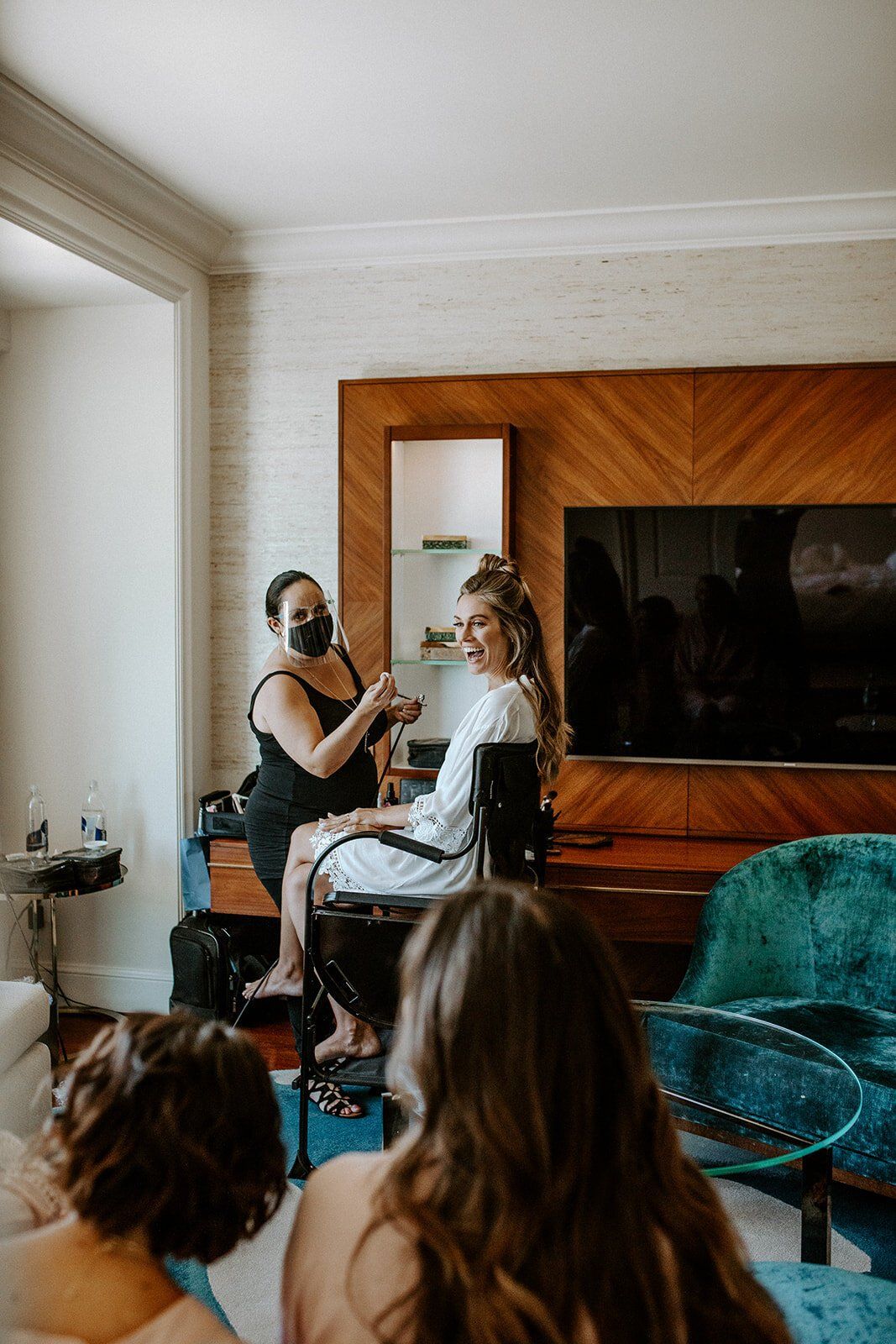makeup artist getting bride ready for beautiful malibu micro wedding