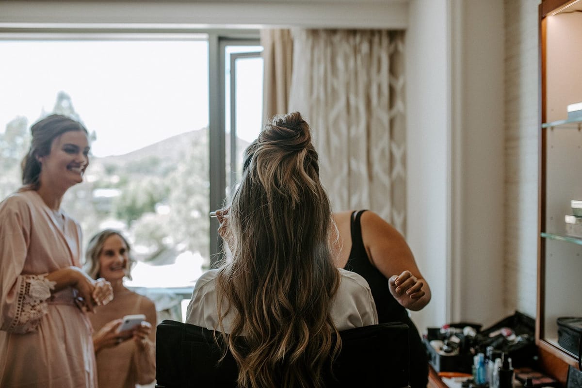 hair and makeup for the bride and bridal party at the four seasons, westlake village