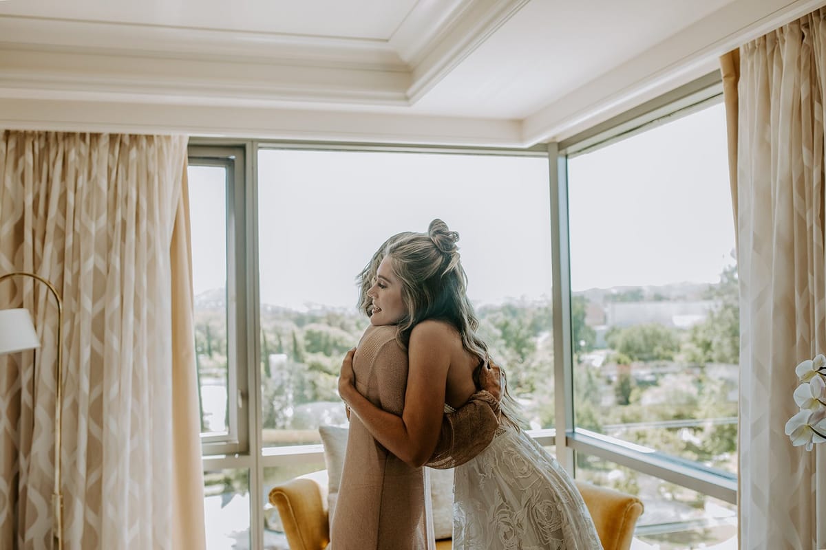 bride and mother sweet moment before malibu wedding ceremony