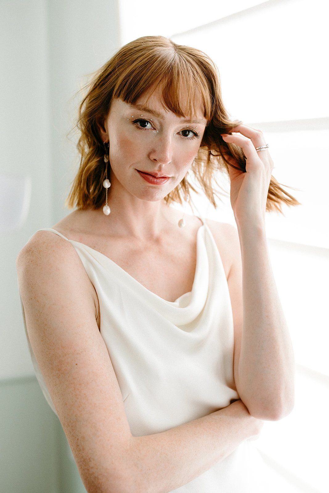 bride goes for natural, chic, and modern hair and makeup look before her elopement in LA