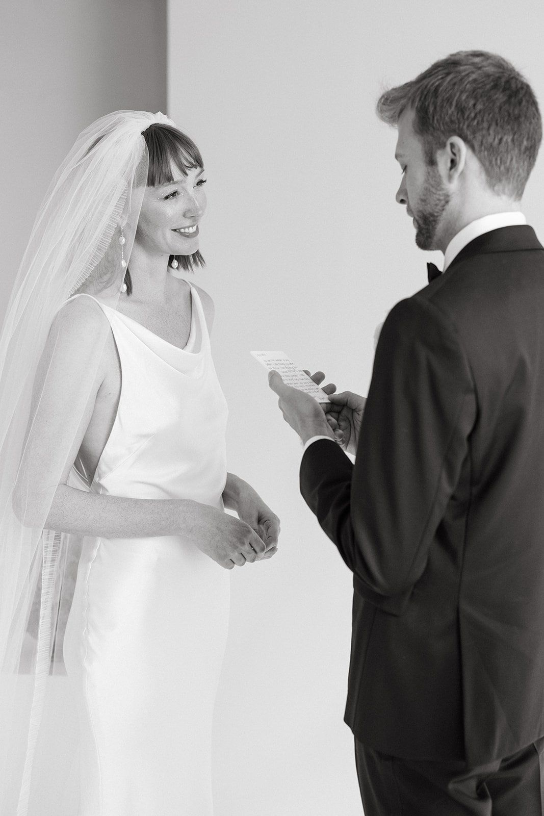 bride reading her vows at her wedding ceremony