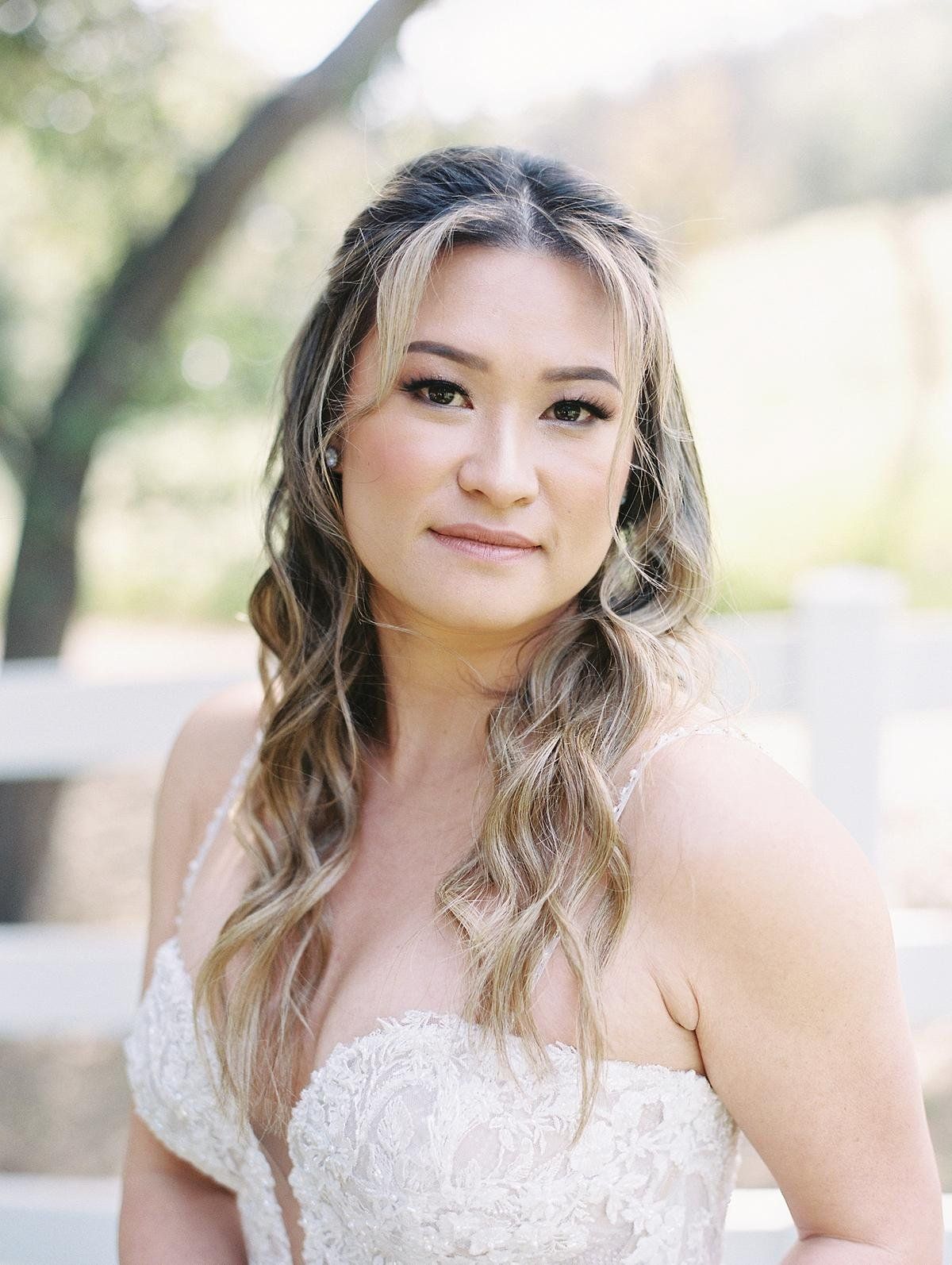bride's natural makeup and stunning loose coastal beach wave look for her wedding at Saddlerock Ranch